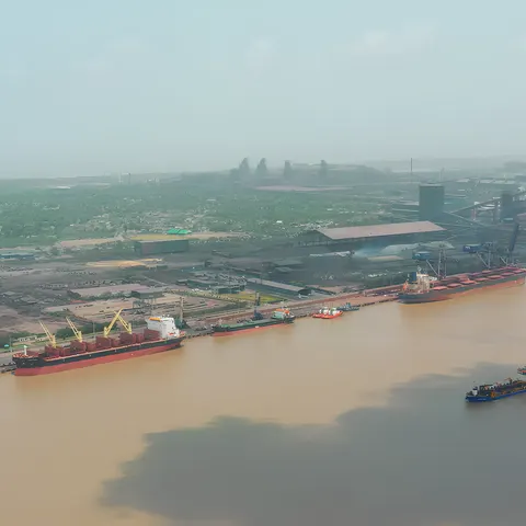 Bulk carriers berthed along the quay at Hazira