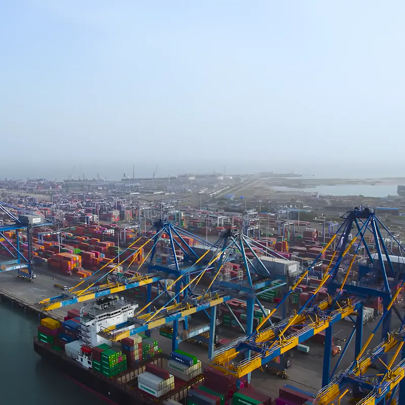 Quay cranes and stacked containers at Mundra port